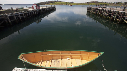 A dory in the water in Lunenburg Harbour.